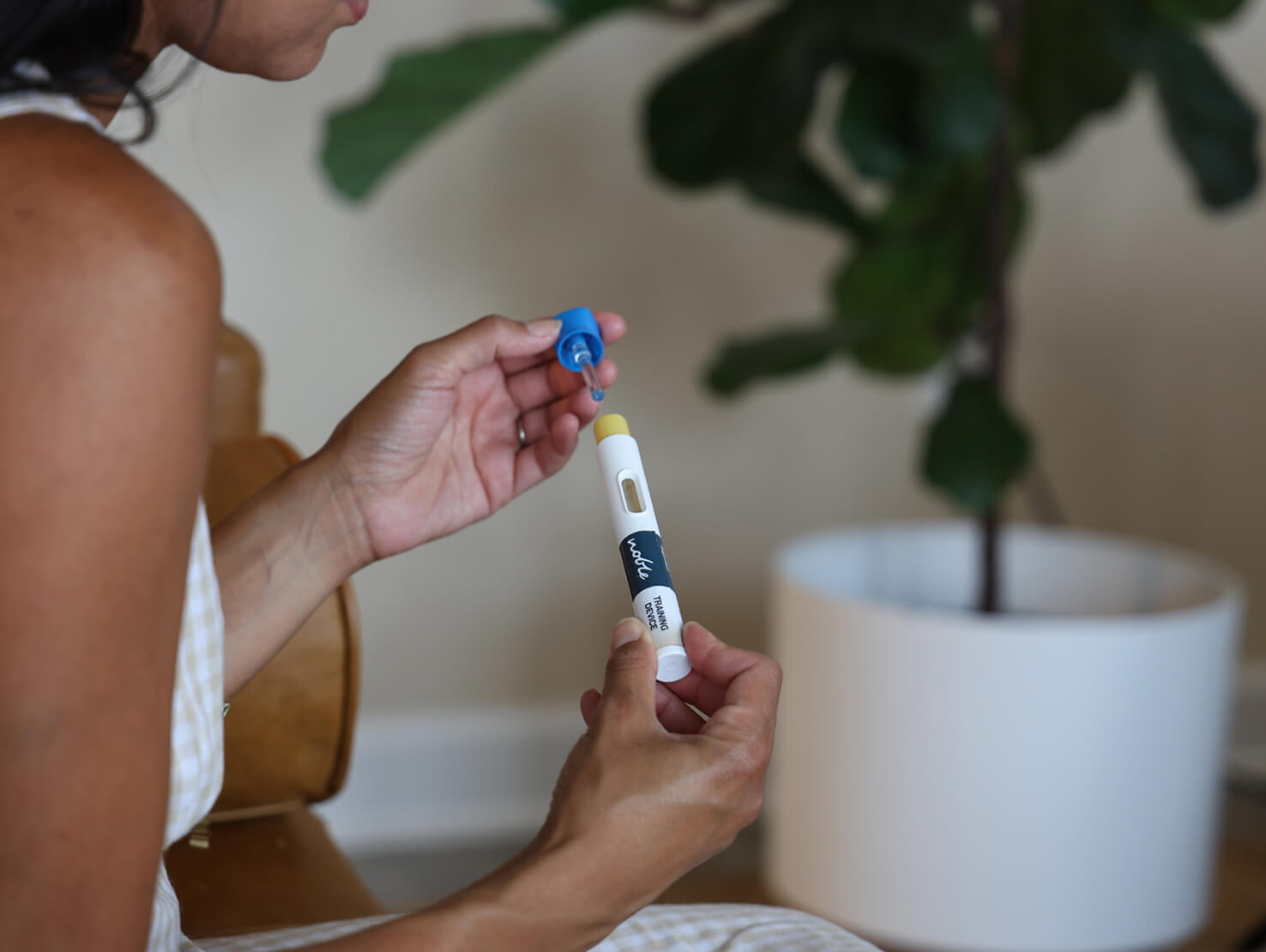 woman with autoinjector