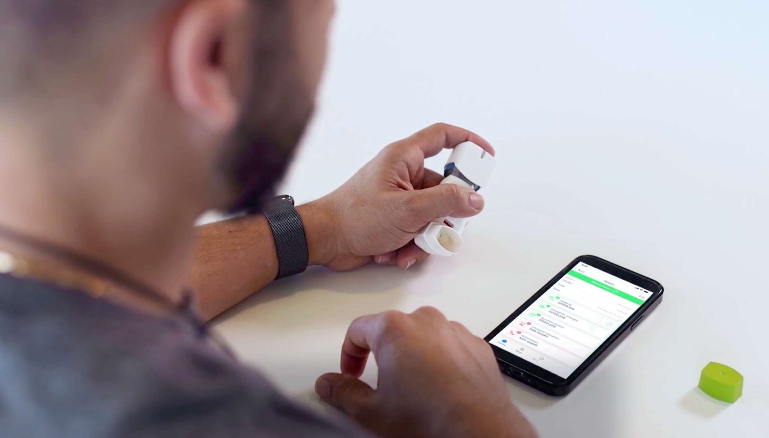 man with inhaler and instructions