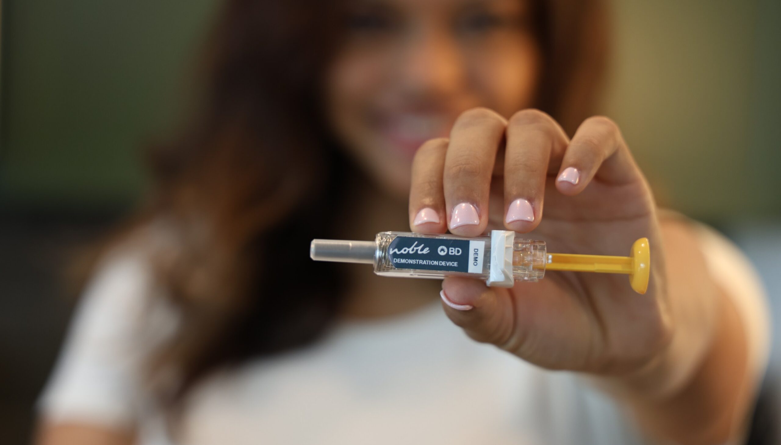 woman holding PFS trainer